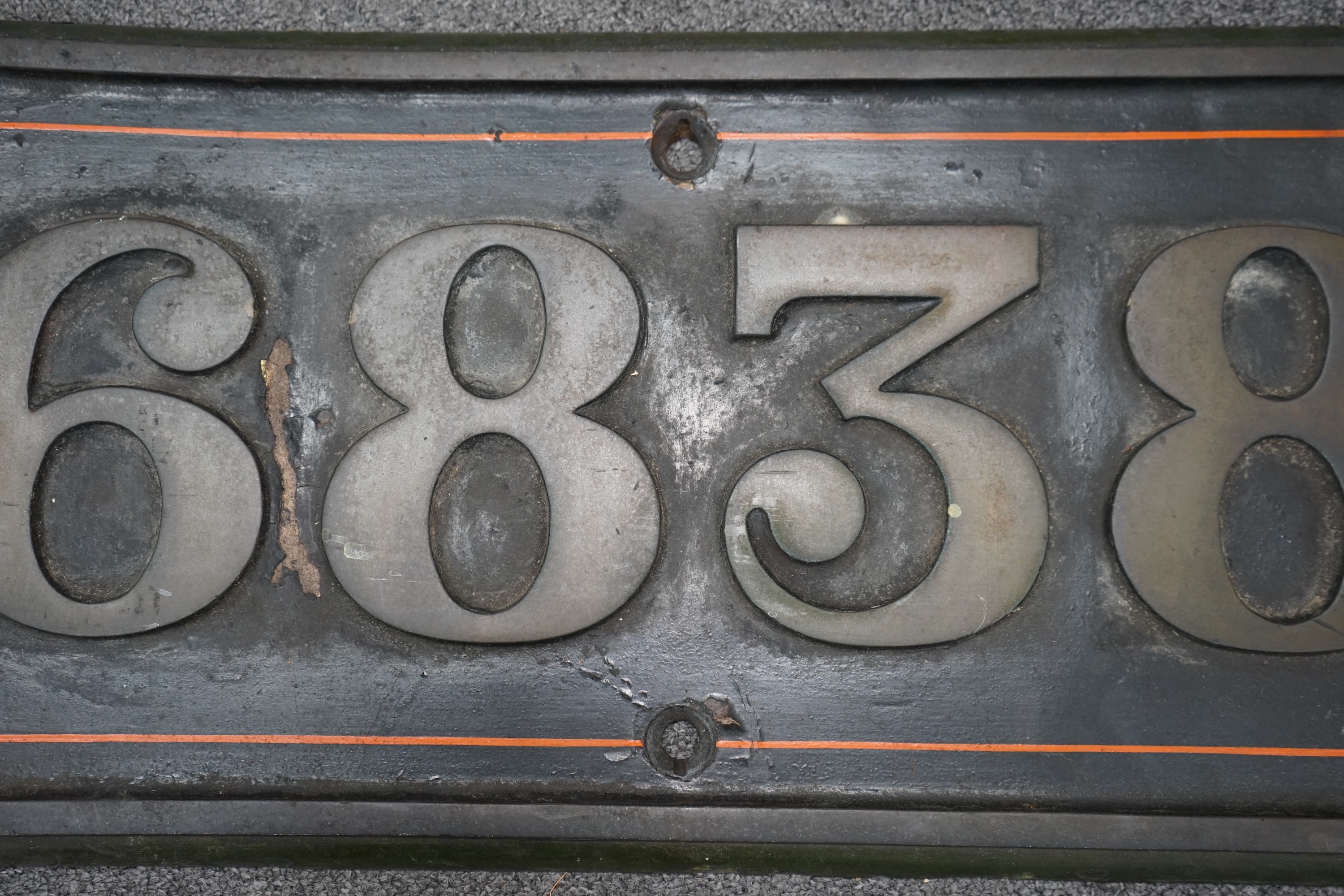 A cast iron GWR locomotive cab side number plate for a Grange Class 4-6-0 tender locomotive, Goodmoor Grange 6838, built in September 1937 and withdrawn by BR in November 1965, dimensions; 64cm x 30cm. Condition - fair,